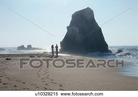 Stock Photography - Couple Walking On Beach. Fotosearch