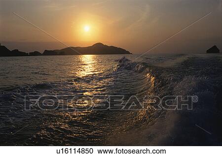 The Setting Sun And A Wave View Large Photo Image Stock Image - The Setting Sun And A Wave. Fotosearch