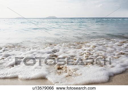 Wave on sandy beach, St John, US Virgin Islands, USA View Large Photo Image Stock Photograph - Wave on sandy beach, St John, US Virgin Islands, USA. Fotosearch