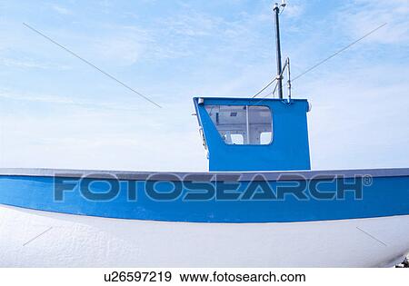 Stock Photo - Blue and white fishing boat. Fotosearch