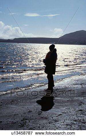 Person Standing On Beach View Large Photo Image Stock Photo - Person Standing On Beach. Fotosearch