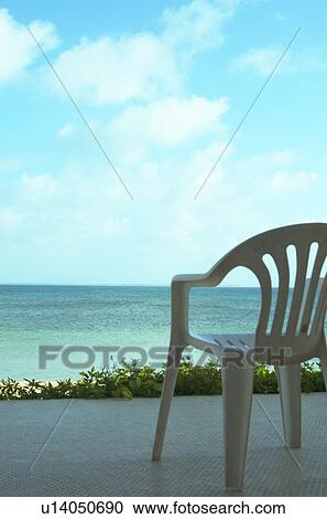 The Blue Sea And A White Chair View Large Photo Image Stock Image - The Blue Sea And A White Chair. Fotosearch