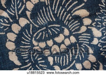 Stock Image - Foliate Patterns On Blue Cloth. Fotosearch