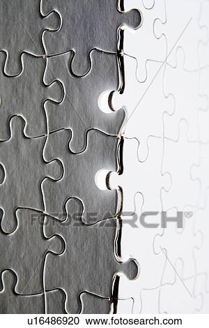 Stock Image - Gray and White Jigsaw Pieces. Fotosearch
