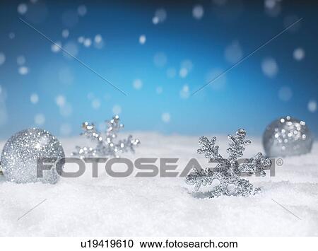 Stock Image - Christmas Decorations in Snow. Fotosearch