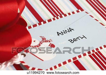 Christmas present tag (close-up) View Large Photo Image Stock Image - Christmas present tag (close-up). Fotosearch