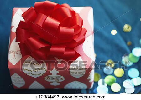 Christmas present with ribbon bow (close-up) View Large Photo Image Stock Photo - Christmas present with ribbon bow (close-up). Fotosearch
