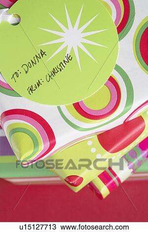 Stock Image - Christmas presents with tags (directly above). Fotosearch