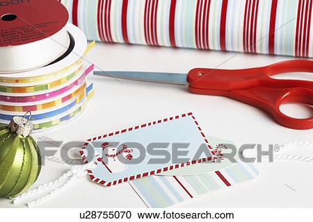 Christmas wrapping material and scissors View Large Photo Image Stock Image - Christmas wrapping material and scissors. Fotosearch