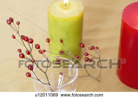 Decorative branch with berries and candles (close-up) View Large Photo Image Stock Photo - Decorative branch with berries and candles (close-up). Fotosearch
