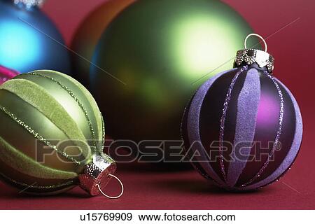 Green and purple baubles (close-up) View Large Photo Image Stock Photo - Green and purple baubles (close-up). Fotosearch