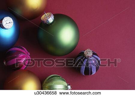 Stock Photo - Green and purple baubles (high angle view). Fotosearch