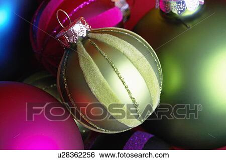 Stock Photograph - Green and red baubles (close-up). Fotosearch