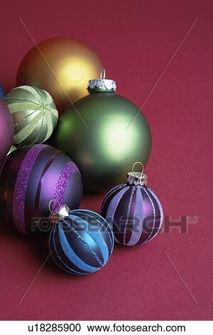 Stock Image - Six baubles (high angle view). Fotosearch