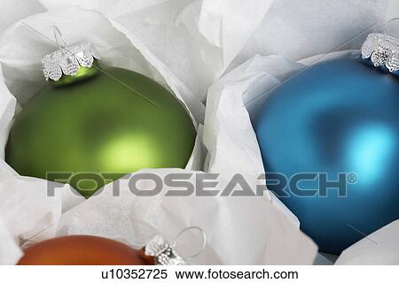 Two baubles in wrapping paper (close-up) View Large Photo Image Stock Photography - Two baubles in wrapping paper (close-up). Fotosearch