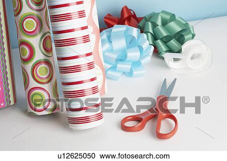Wrapping paper, ribbons and scissors on floor View Large Photo Image Stock Image - Wrapping paper, ribbons and scissors on floor. Fotosearch