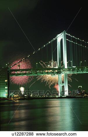 Stock Photo - Fireworks And Rainbow Bridge. Fotosearch