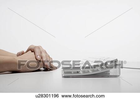 Stock Photograph - Young woman's hands near computer keyboard (close-up). Fotosearch