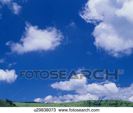 Stock Image - Clouds Above Hill. Fotosearch