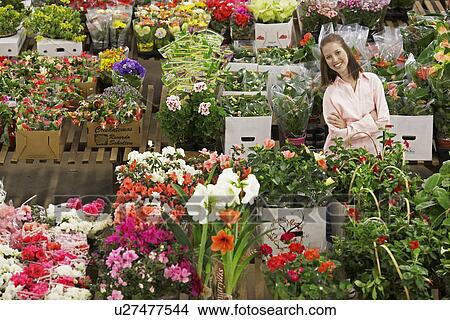 Picture - Female customer in flower shop. Fotosearch