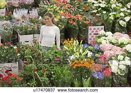 Female customer in flower shop View Large Photo Image Stock Photo - Female customer in flower shop. Fotosearch