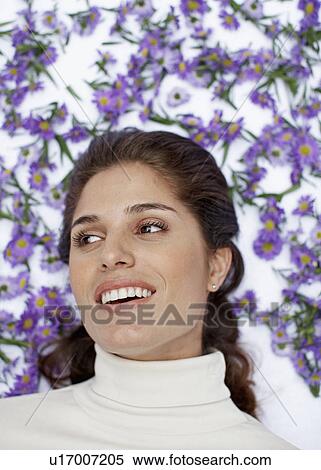 Mid Adult Woman Surrounded by Flowers View Large Photo Image Stock Photography - Mid Adult Woman Surrounded by Flowers. Fotosearch