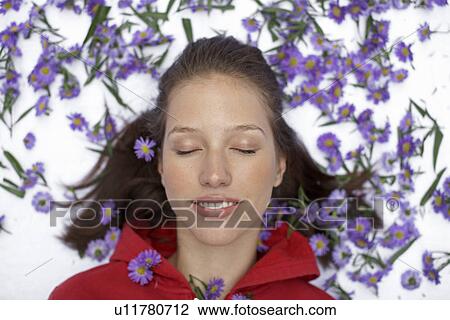 Woman surrounded by flowers (directly above) View Large Photo Image Stock Image - Woman surrounded by flowers (directly above). Fotosearch