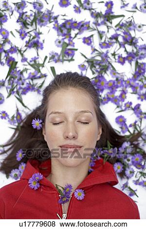 Woman surrounded by flowers (directly above) View Large Photo Image Stock Photo - Woman surrounded by flowers (directly above). Fotosearch