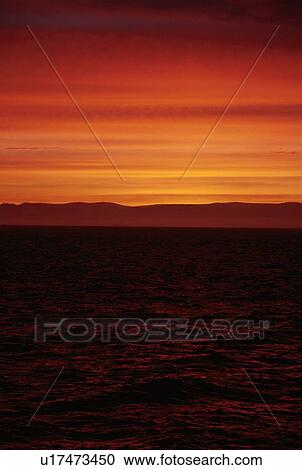 Stock Image - Sunset Above Mountain Range. Fotosearch