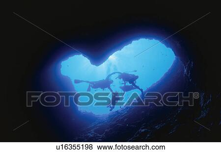 Stock Photo - An Underwater Cave And A Diver. Fotosearch