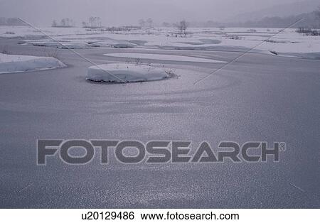 Frozen Pond With Snow Patches View Large Photo Image Stock Photograph - Frozen Pond With Snow Patches. Fotosearch