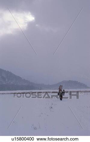 Stock Image - Men In Field. Fotosearch