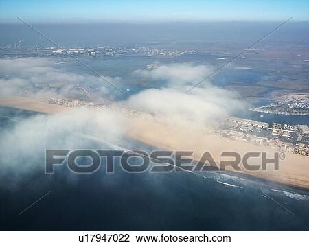 Aerial view of clouds covering beachfront in Southern California View Large Photo Image Stock Image - Aerial view of clouds covering beachfront in Southern California. Fotosearch