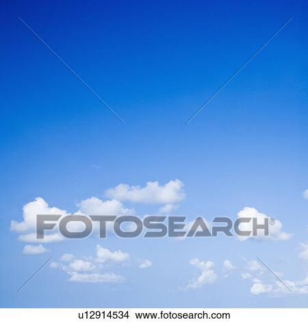 Picture - Blue sky with some white puffy clouds.. Fotosearch