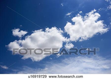 Stock Photo - Cumulus cloud formation in blue sky. Fotosearch