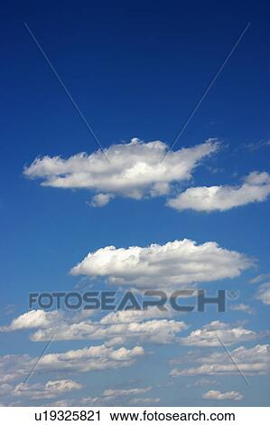 Fluffy clouds in blue sky. View Large Photo Image Stock Image - Fluffy clouds in blue sky.. Fotosearch