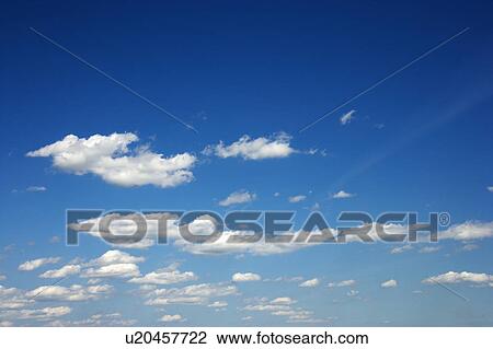 Fluffy clouds in blue sky View Large Photo Image Stock Image - Fluffy clouds in blue sky. Fotosearch