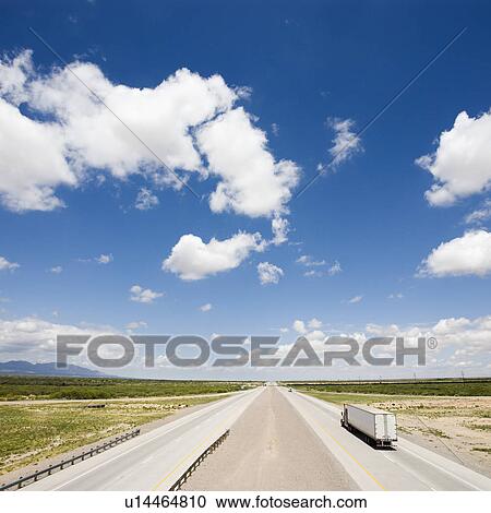 High angle view of highway with tractor trailer truck and blue cloudy sky. View Large Photo Image Stock Image - High angle view of highway with tractor trailer truck and blue cloudy sky.. Fotosearch