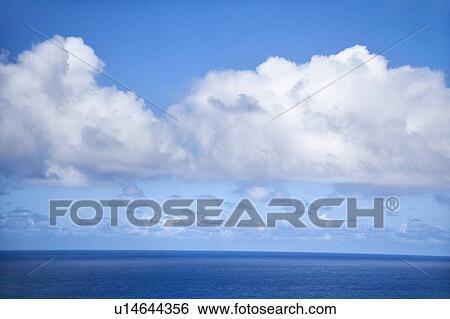 Stock Photograph - Horizon of Pacific ocean and blue sky with clouds. Fotosearch