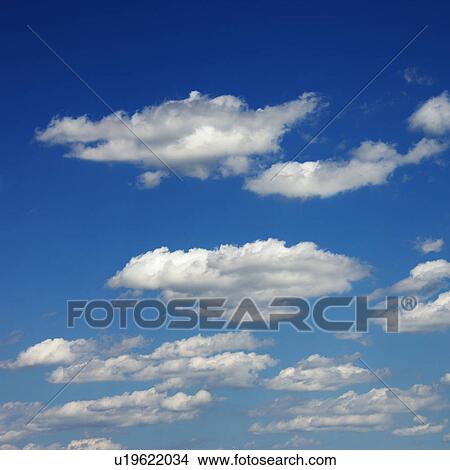 Peaceful clouds in blue sky View Large Photo Image Picture - Peaceful clouds in blue sky. Fotosearch