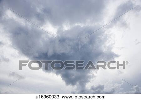 Stock Image - Sky with large cumulus cloud formation. Fotosearch