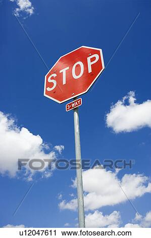Stop sign with blue cloudy sky. View Large Photo Image Stock Image - Stop sign with blue cloudy sky.. Fotosearch
