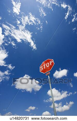 Stop sign with blue cloudy sky. View Large Photo Image Stock Image - Stop sign with blue cloudy sky.. Fotosearch