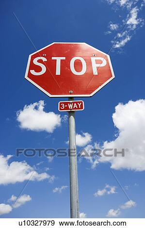 Stock Photo - Stop sign with blue cloudy sky.. Fotosearch