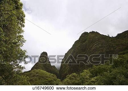 Stock Image - Maui, Hawaii mountain landscape with clouds. Fotosearch