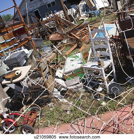 Stock Photography - Chaotic mess of junk strewn across junkyard outdoors.. Fotosearch