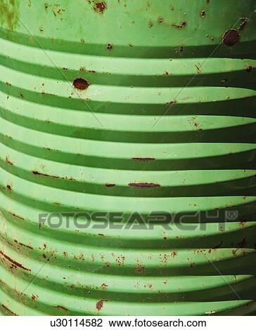 Stock Image - Closeup of metal green container.. Fotosearch