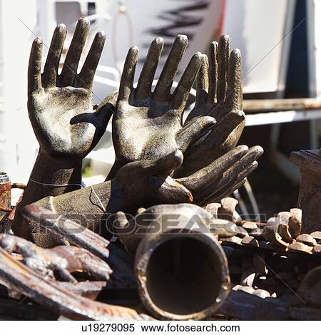 Stock Photography - Collection of metal statuettes in a pile.. Fotosearch