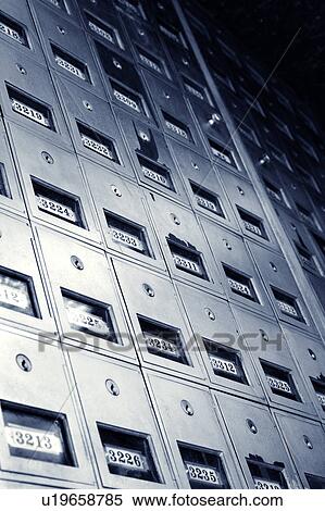 Stock Photography - Low angle view of metal mailboxes.. Fotosearch