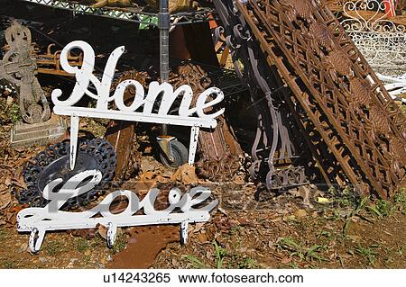 Metal garden decorations of words Love and Home next to rusted metal objects View Large Photo Image Stock Photography - Metal garden decorations of words Love and Home next to rusted metal objects. Fotosearch